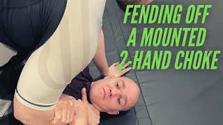 How to Defend Against a 2-Hand Choke from Mount on the Ground
