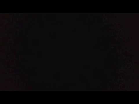 Ösregn och blixt i natthamnen Stendörren.