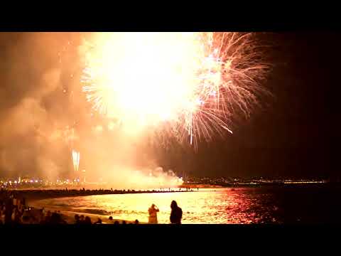 mixkit fireworks illuminating the beach sky 4157