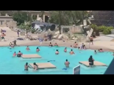 Dust devil sends pool furniture flying at Vegas hotel pool