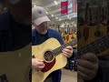 The great Bryan Sutton playing a Young Workhorse for a bit while sneaking his way thru Amigo Guitar