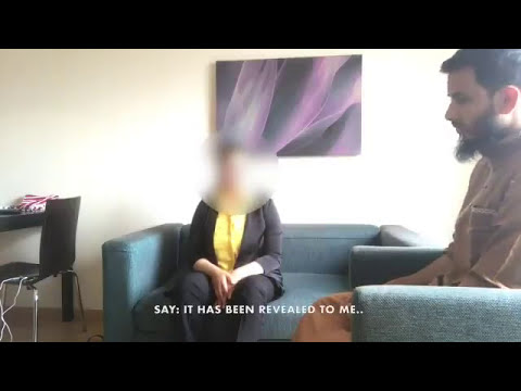 Jinn inside an innocent woman making satanic hand symbols and referring to a recent song released.