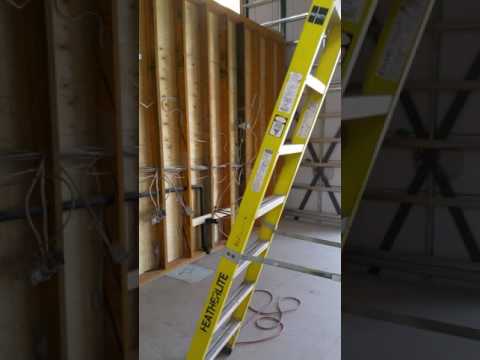 DRYWALL IN THE DOOR AND UP TO THE SECOND FLOOR