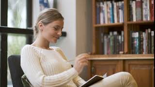 Library Beautiful Woman Thinking and Taking Notes Working HD Video Loop Background