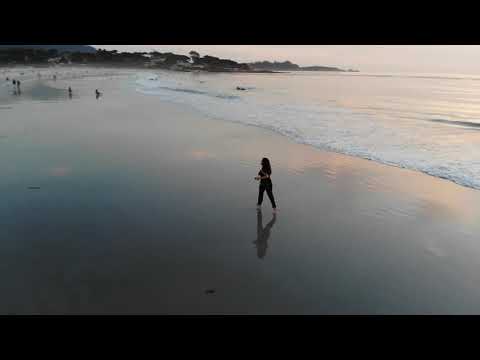 Nicoleta chased by DjiMavic on the beach of Monterey California