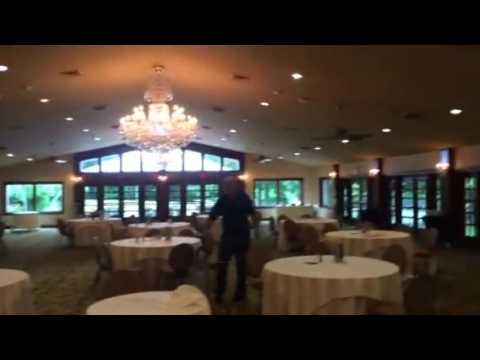 A wedding DJ bringing equipment into a venue