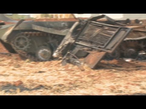 Rebels take army base, leave charred tanks