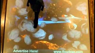 Interactive Projection System in Shopping Mall. Animate Effect with Meteor Theme.