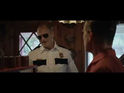 Official red-band trailer frame: the three red billboards on a lonely Missouri roadside