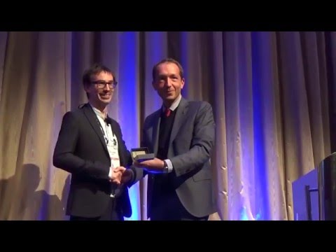 Guillaume Habert receives the 2015 Robert L'Hermite Medal from Nicolas Roussel, RILEM TAC Chair