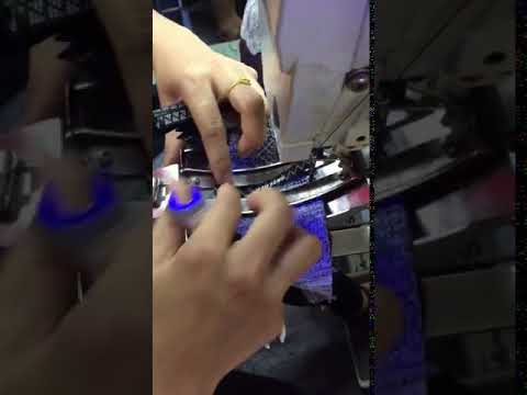 Sewing a tape-label on the tongue of a sneaker using a bartacking machine video