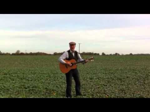 Winston Harrold, the Singing Farmer, performing in one of h