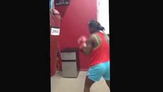 Claressa Shields female boxer TBE punching the bag