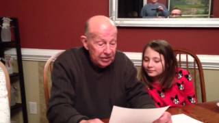 Daddy reads a Christmas story.