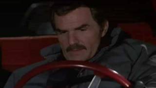 Lisa Minnelli gets goosed; Burt Reynolds smiles in secret satisfaction.