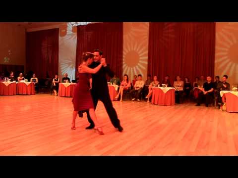  Fausto Carpino  and  Stephanie Fesneau  are  dancing  to  a  tango