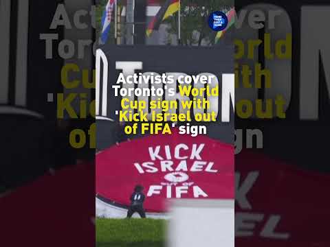 Watch activists in Toronto cover a FIFA sign with 