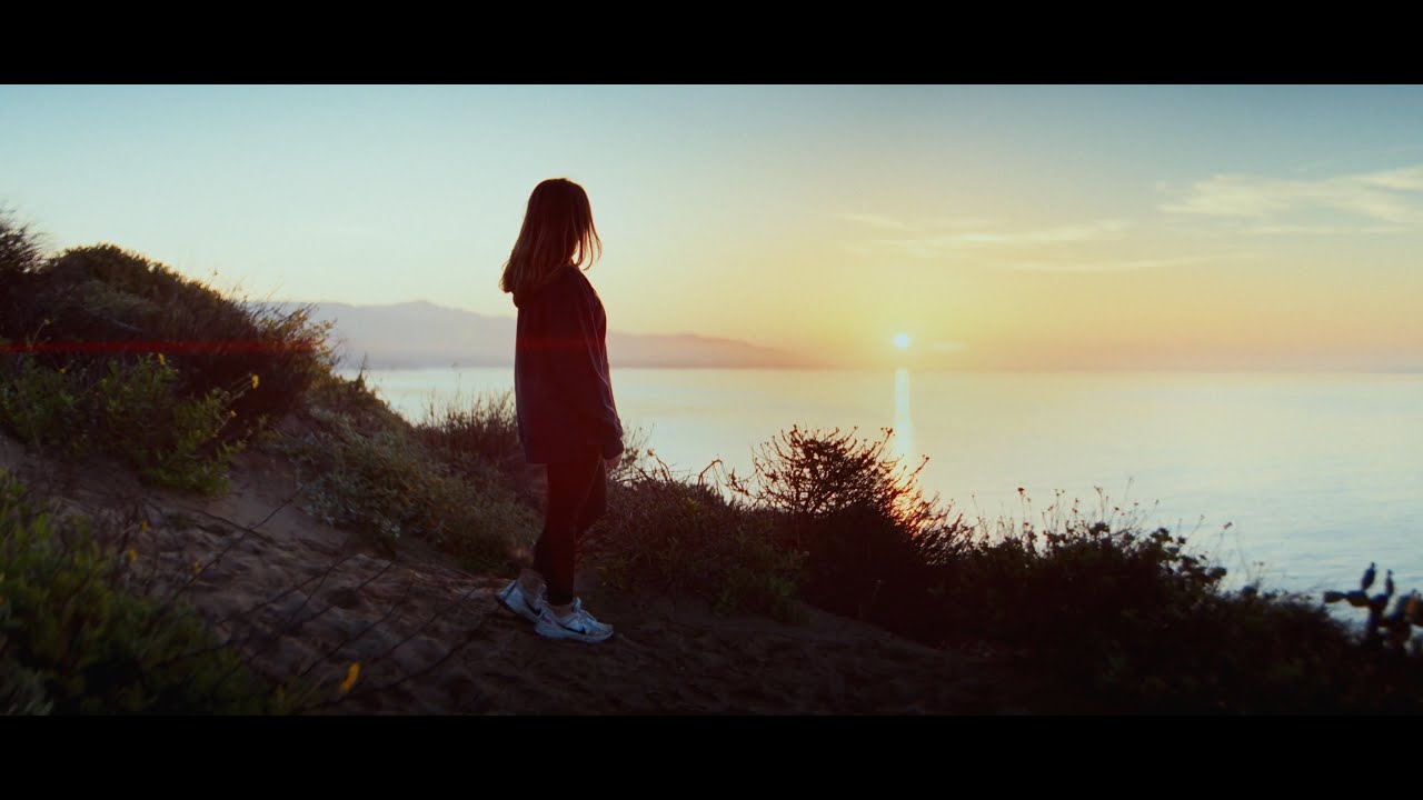 Thumbnail for video: Person watching sunset over the ocean