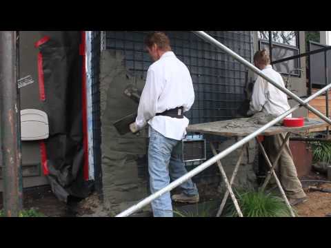 Reinforce a concrete block chimney with rebar and stucco. Video