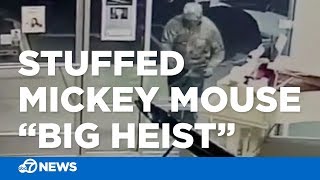 CAUGHT ON CAMERA: Man steals stuffed Mickey Mouse from piano store