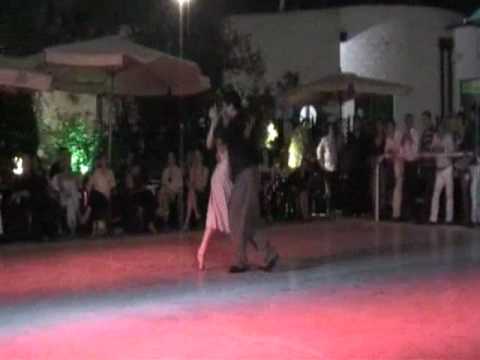  Pamela Ramos Aracena  and  Carlos Espinoza  are  dancing  to  the  tango  "  Si La Llegaran A Ver  "