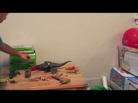 Toy Dinosaurs fighting over Trophy.  With averagebabydean .