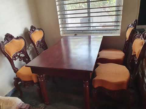 Circular wooden dining table