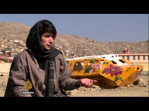 Artist in Afghanistan turns tanks into her canvas