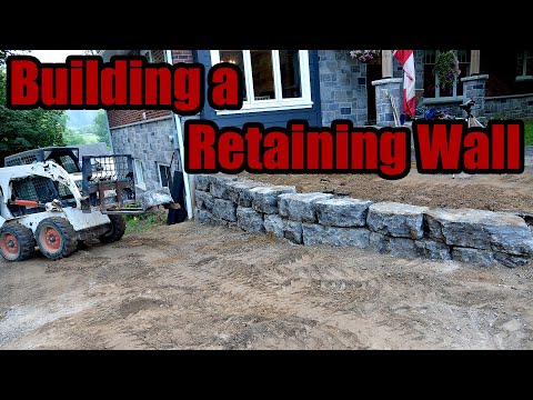 Building an Armor Stone Retraining Wall with an Old Backhoe and Skid Steer