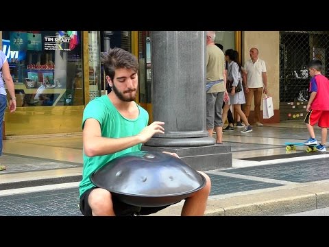 Street Music in Italy. Playing the Hang Instrument. Steelpan. Seen in Turin