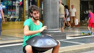 Street Music in Italy. Playing the Hang Instrument. Steelpan. Seen in Turin