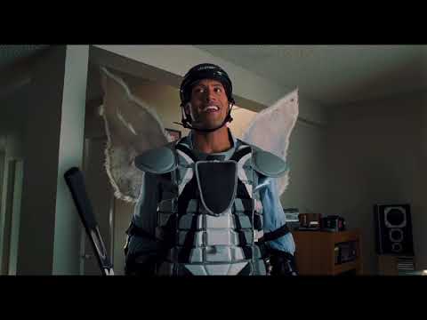 Official trailer still: Dwayne Johnson as Derek Thompson facing a pink tutu and a pair of fairy wings—cue the score’s comic-hero pulse