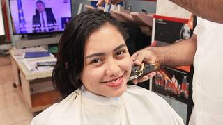 Tourist girl loves a barber shop cut
