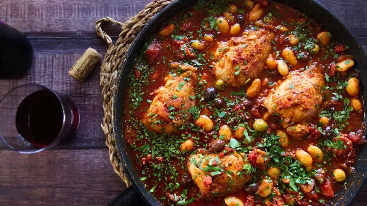 A large pan of Spanish chicken with chorizo and wine
