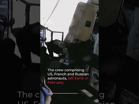 Four astronauts return to earth after an eight-month space mission