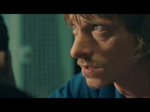 Trailer frame: platform decision moment underscored by Trevor Jones’ cue