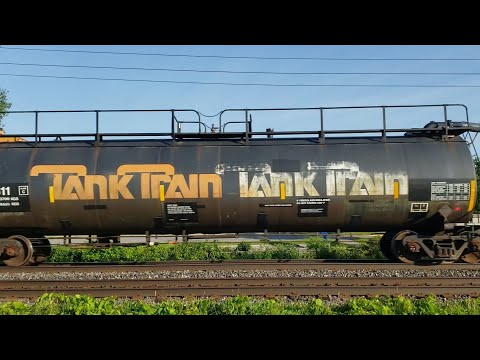 TRAINS CN 321 Freight  With Classic Tank Train Black at Pointe Claire EXO Station