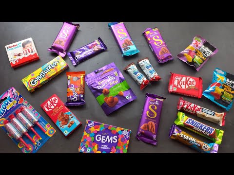 100 candies opening, surprise toys, chocolate a video, lots of chocolates, Cadbury celebration