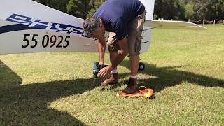 Demonstration how to Tie Down Light Aircraft on Rough Airfields