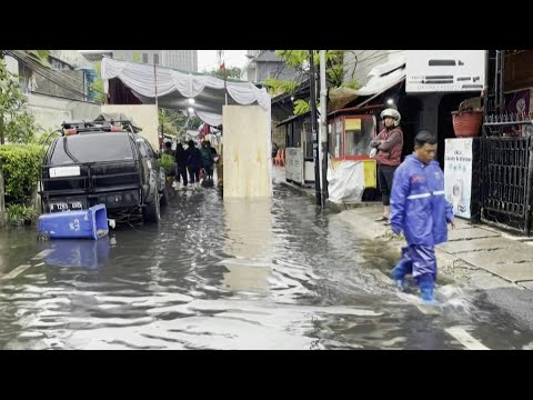 Heavy rain, flooding as Indonesia goes to the polls | AFP