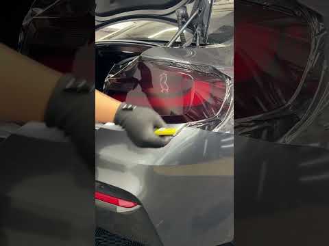 Taillight tint using luxe mid smoke vinyl with the help of off wrap squeegee and wrap glove