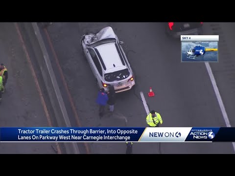 Tractor trailer crashes into barrier on Parkway West