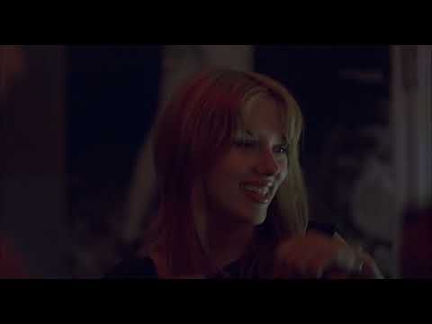 Lost in Translation trailer frame of Bob and Charlotte in a karaoke room under coloured lights