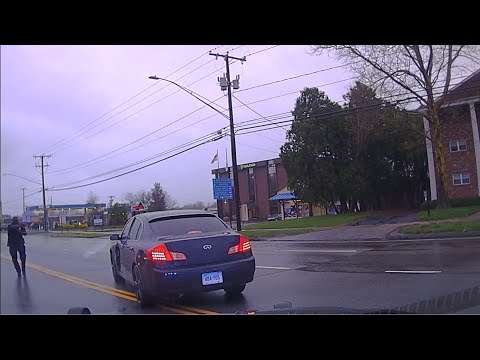 Videos of a fatal police shooting of a Conn. man were made public Friday, after days of protests. The video shows a Wethersfield officer shooting at the car being driven at him during an attempted traffic stop on April 20. (May 3)