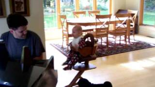 Marin dancing in high chair to Carole King