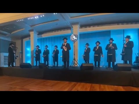 Motty Illowitz & Lev Choir Sharing The Stage At an Event For Kapayim Organization