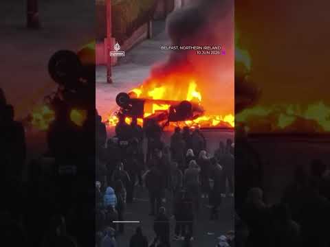 Anti-immigrant protesters clash with police, torch car at Belfast rally | AJ #shorts