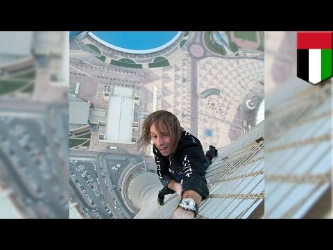 French Spiderman climbs skyscraper: Extreme urban climber Alain Robert scales Dubai’s Cayan Tower