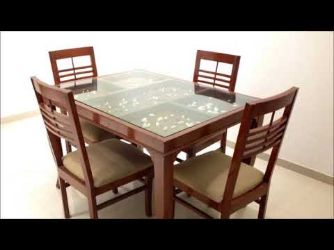 Glass top dining table with wooden base