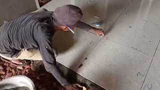 workers learning to lay tiles//workers laying tiles part2
